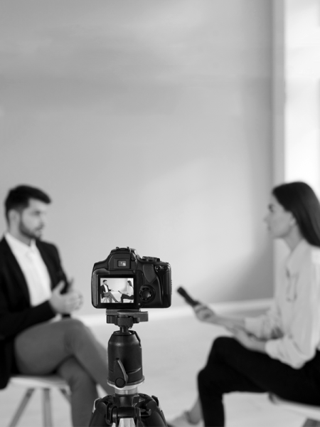 people talking in front of a camera